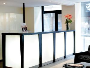 a blue and white counter in a room at New Hotel Saint Lazare in Paris