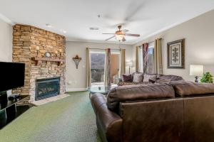 a living room with a couch and a fireplace at Bon Air Unit 4032 in Gatlinburg