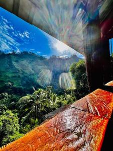 a view of a view of a mountain from a bench at Mount Wood Star in Ella