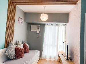 Postel nebo postele na pokoji v ubytování Lovely 1 Bedroom unit in Avida w/ WiFi (upto 4 pax) + 2 fotografie