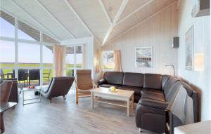 a living room with a couch and a table at Strandblick 31 in Schönhagen
