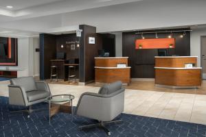 a waiting room with two chairs and a table at Courtyard by Marriott San Diego Carlsbad in Carlsbad