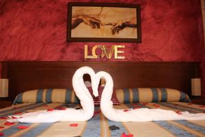 Postel nebo postele na pokoji v ubytování Hotel La Curva