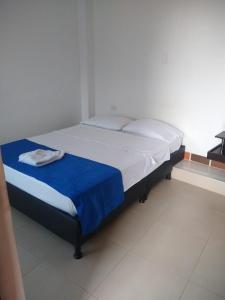 Un pat sau paturi într-o cameră la BONANZA