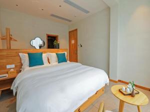 Ένα ή περισσότερα κρεβάτια σε δωμάτιο στο Villa EN Emerald Valley, Huangshan