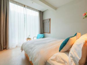 Ένα ή περισσότερα κρεβάτια σε δωμάτιο στο Villa EN Emerald Valley, Huangshan