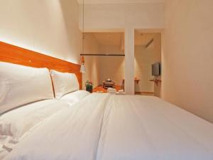 Ένα ή περισσότερα κρεβάτια σε δωμάτιο στο Villa EN Emerald Valley, Huangshan