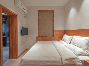 Ένα ή περισσότερα κρεβάτια σε δωμάτιο στο Villa EN Emerald Valley, Huangshan