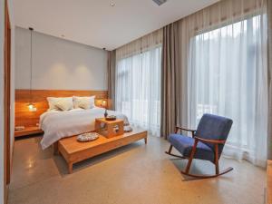Ένα ή περισσότερα κρεβάτια σε δωμάτιο στο Villa EN Emerald Valley, Huangshan