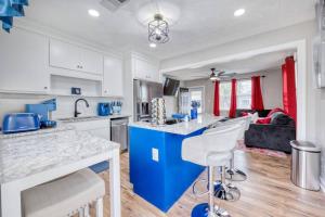 a kitchen with a blue island in a room at Cozy Home with City Views in Columbus