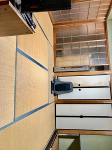 a small kitchen with two drawers and a window at Hotel Ryokan Togenkyo - Vacation STAY 97146v in Ise