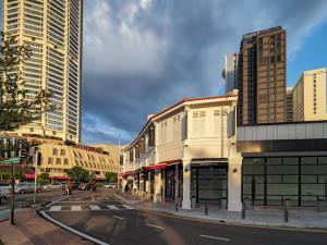 a street in a city with tall buildings at Magazine Vista Hotel by PHC in George Town
