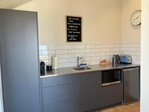 a kitchen with a sink and a counter top at The Quarters Unit 1 - Lake Tekapo in Lake Tekapo