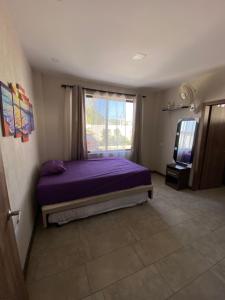 A bed or beds in a room at Departamento Playas Villamil vacaciones