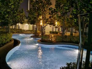 a swimming pool in a building at night at Orion Suites@ The Robertson Bukit Bintang in Kuala Lumpur +36 photos