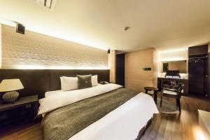 Postel nebo postele na pokoji v ubytování Jbis Hotel
