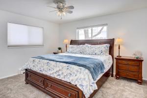 a bedroom with a bed and a ceiling fan at Denver Home with Game Room, 11 Mi to Downtown! in Centennial