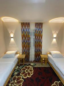 Ένα ή περισσότερα κρεβάτια σε δωμάτιο στο Naqqosh