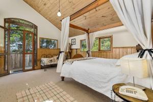 a bedroom with a large bed in a house at Walshan House in Apollo Bay