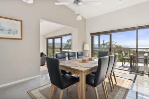 a dining room with a table and chairs at Amaroo in Marengo