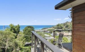 a balcony with a view of the ocean at 2 Degrees of Separation in Wye River