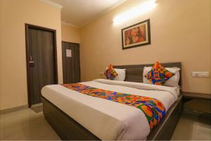 Postel nebo postele na pokoji v ubytování FabHotel GD Sunrise Inn Amritsar + 27 fotografií