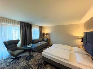 Postel nebo postele na pokoji v ubytování Appartment-Hotel-Hölzl