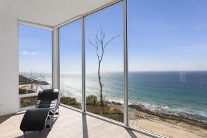 a view of the ocean from a room with windows at Southpoint -Brand new home, oceanfront views in Wye River