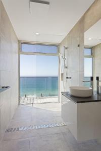 a bathroom with a sink and a view of the ocean at Southpoint -Brand new home, oceanfront views in Wye River