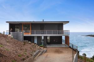 a house on a hill overlooking the ocean at At Wye Eyrie II in Wye River