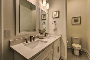 a bathroom with a sink and a toilet and a mirror at Santa Rosa Beach Vacation Rental Near Ocean! in Santa Rosa Beach +21 photos