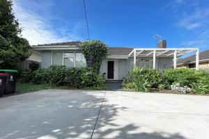 a house with a driveway in front of it at Pet-friendly Bayside 4BR Rental House near Mentone in Parkdale