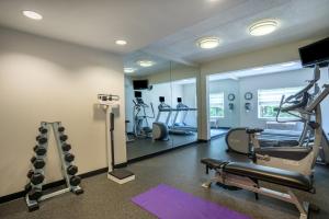 a gym with treadmills and ellipticals in a room at Holiday Inn Baltimore BWI Airport by IHG in Linthicum Heights