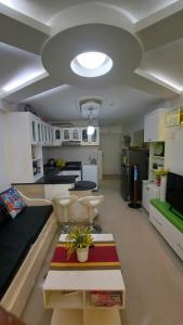 a large room with a kitchen and a living room at 1bedroom one oasis condo fullyfurnished in Davao City