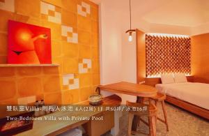 Rúm í herbergi á 白色海芋Villa