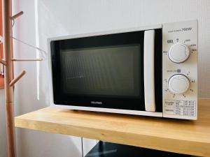 TV a/nebo společenská místnost v ubytování 池袋Apila
