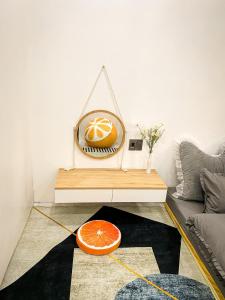 a room with a table with an orange on it at KS - Homestay MyLan in Lạng Sơn