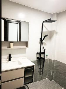 a bathroom with a shower and a sink at KS - Homestay MyLan in Lạng Sơn