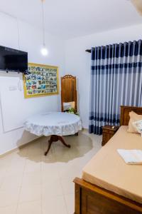 Rúm í herbergi á Classic Elegance Hotel