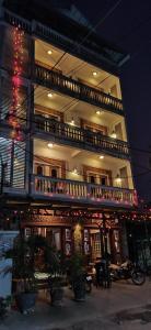 a large building with a balcony on top of it at Beat Hotel Siem Reap in Siem Reap