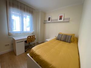 En eller flere senge i et værelse på Ático Rey Daviña Centro y Playa