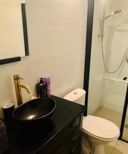 a bathroom with a sink and a toilet at Private Room Studio Suite Jerusalem in Jerusalem