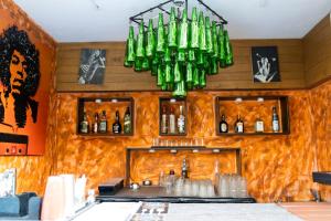 a chandelier hanging over a bar in a restaurant at Sia Signature Calangute in Calangute