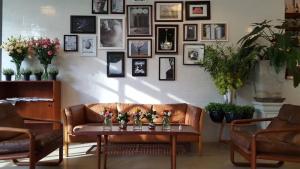 a living room with a couch and a table at Beat Hotel Bangkok in Bangkok