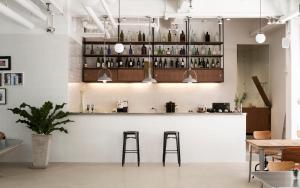 a bar in a restaurant with two stools at Beat Hotel Bangkok in Bangkok