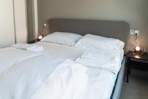 Łóżko lub łóżka w pokoju w obiekcie 3058 Residence Lamar 3058