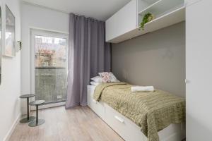 Posteľ alebo postele v izbe v ubytovaní CityCenterApartments-11/19