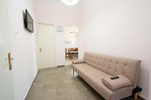TV a/nebo společenská místnost v ubytování Vasilakis Apartment