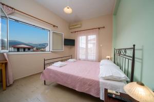 A bed or beds in a room at Vasilakis Apartment