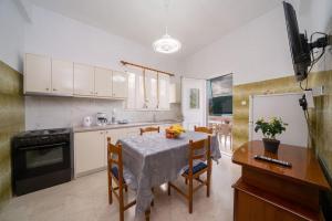 A kitchen or kitchenette at Vasilakis Apartment